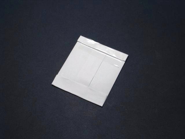 Secure the seed packet with sticky tape